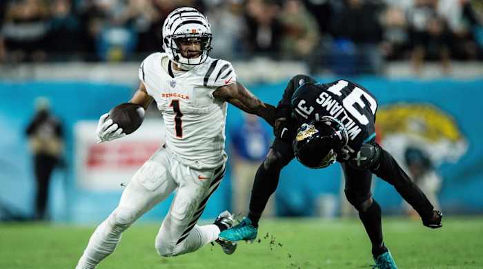 Bengals wide receiver Ja'Marr Chase runs the ball against Jacksonville Jaguars cornerback Darious Williams